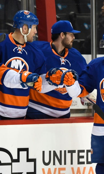 Hickey scores in OT, Islanders beat Flames 2-1